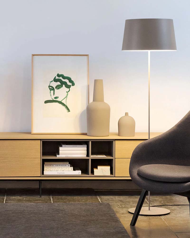 Minimalist Vibia floor lamp providing soft Ketra ambient lighting.