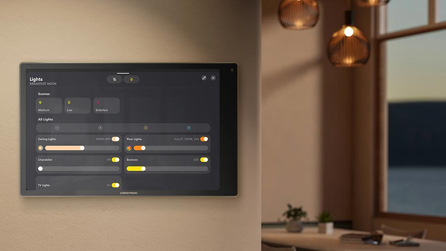 Smart home touch screen interface mounted on a wall displaying light control scenes