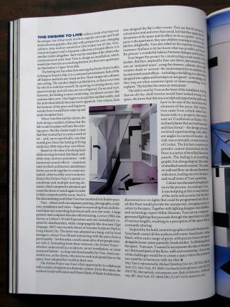 Close-up of an open magazine page featuring a text article alongside architectural photos