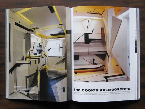 Magazine spread featuring an abstract kitchen with geometric angles and yellow lighting