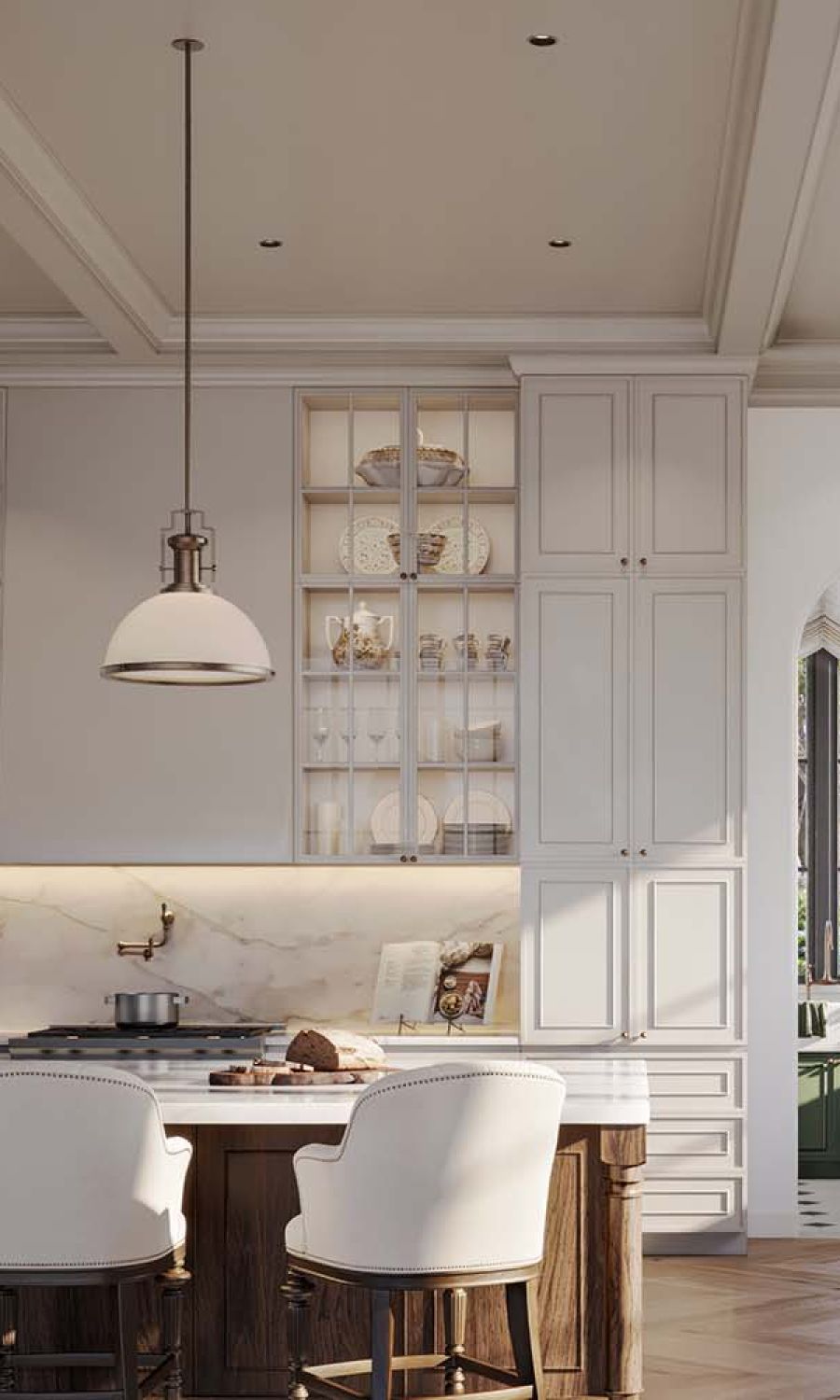 Modern white kitchen lit by pendant lamps and Lutron downlights.