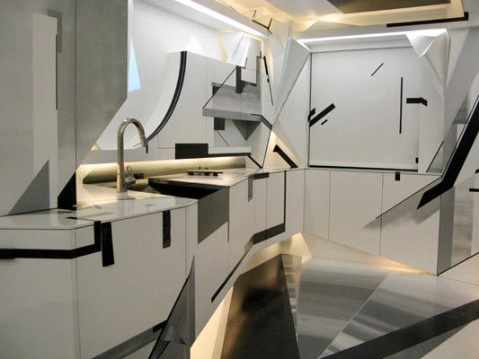 Futuristic white kitchen with sharp sculptural shapes, black line graphics, and warm downlighting