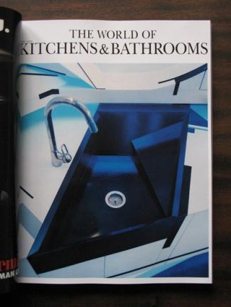 Magazine page highlighting a sharp, custom-angled dark kitchen sink illuminated in blue